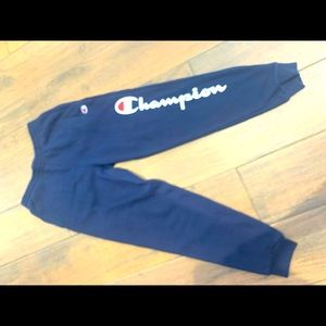 Champion boys navy sweatpants with logo down leg